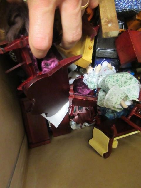 A large box of dolls house furniture and accessories, including mainly wooden furniture, a metal Image
