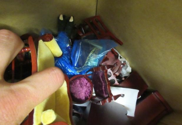 A large box of dolls house furniture and accessories, including mainly wooden furniture, a metal Image