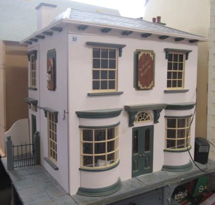 An apothecary shop dolls house, with lazy susan style rotating base and three seperate hinged Image