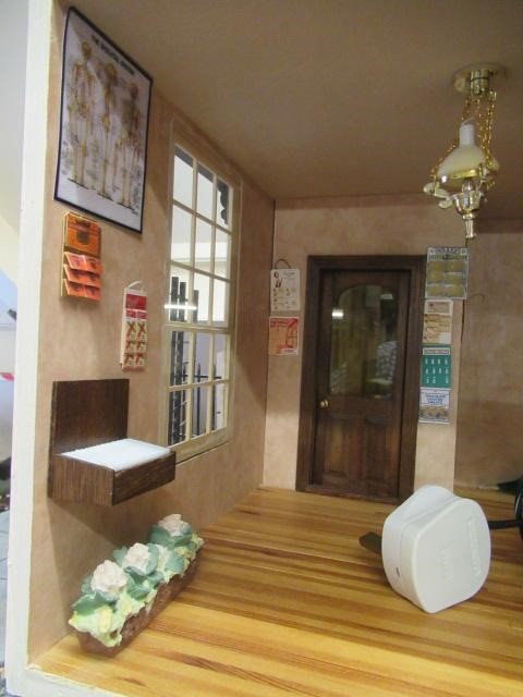 An apothecary shop dolls house, with lazy susan style rotating base and three seperate hinged Image