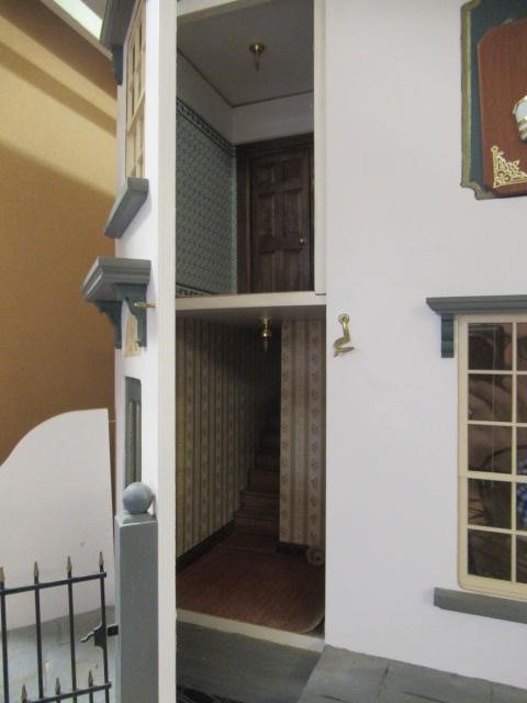 An apothecary shop dolls house, with lazy susan style rotating base and three seperate hinged Image