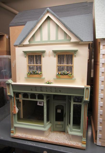 A dolls house shop, "Basil Bonigen", with two hinged opneings to reveal four internal spaces, 15 Image