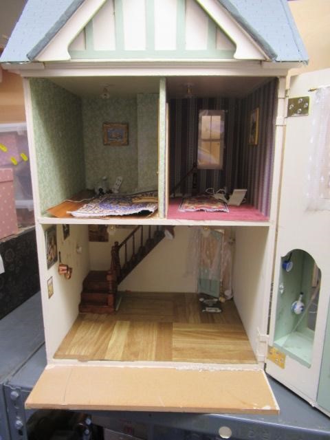 A dolls house shop, "Basil Bonigen", with two hinged opneings to reveal four internal spaces, 15 Image