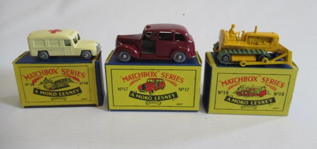 Matchbox 14a Daimler ambulance 49mm, box M, model M, 17c Austin taxi, box M, model M, and 18b Image