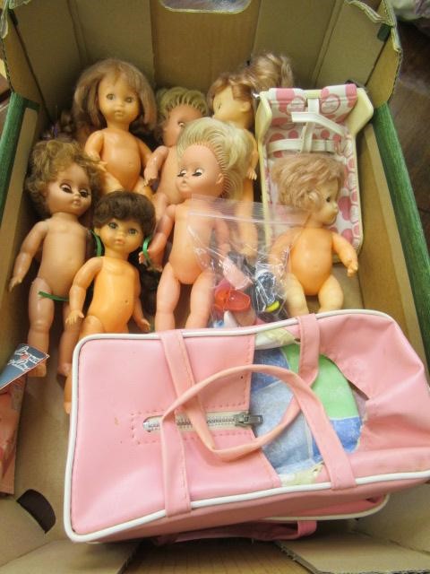 A box of Amanda Jane dolls, comprising seven dolls, a chair, carry cot and associated clothing, Image