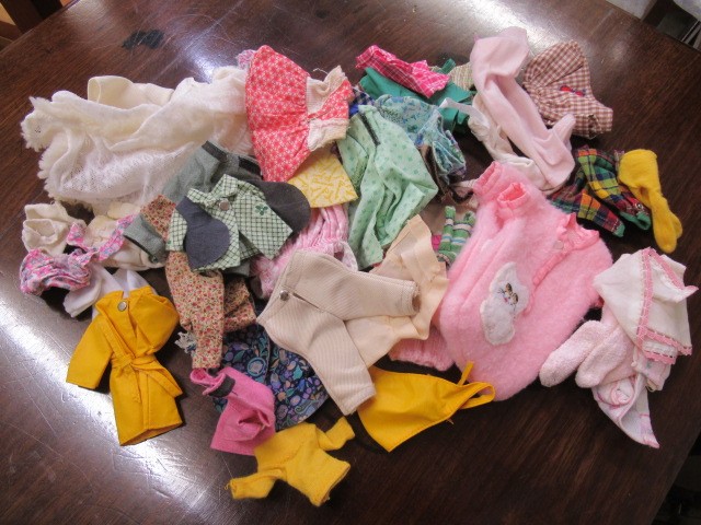 A box of Amanda Jane dolls, comprising seven dolls, a chair, carry cot and associated clothing, Image