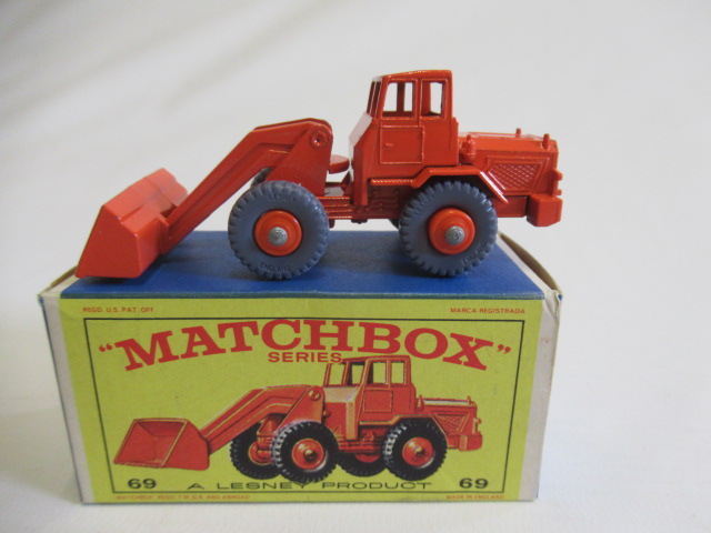 Matchbox 69b Hatra Tractor Shovel, box M, model M, orange body and hubs with grey wheels, small mark Image