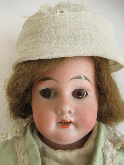 An Armand Marseille bisque shoulder head doll Image