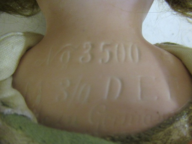 An Armand Marseille bisque shoulder head doll Image