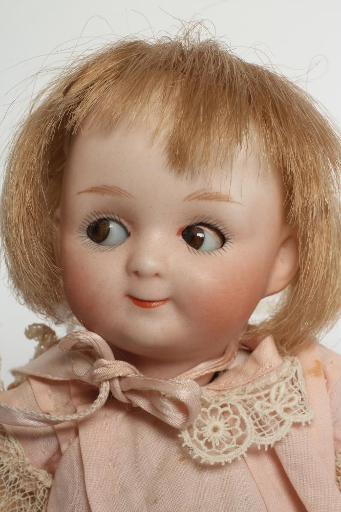 A Gebruder Heubach googly eye bisque socket head doll Image