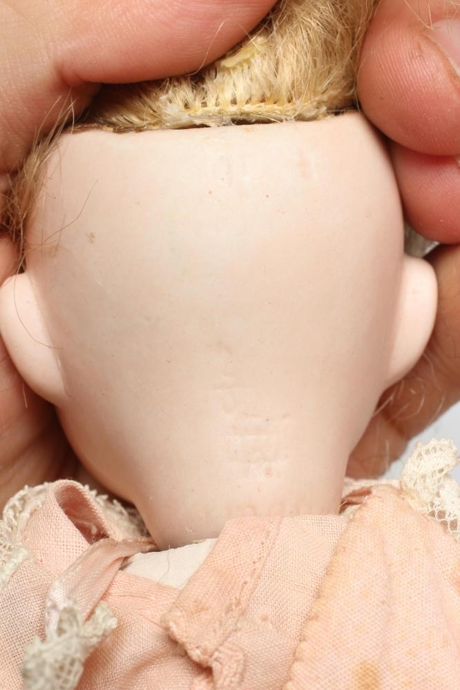 A Gebruder Heubach googly eye bisque socket head doll Image