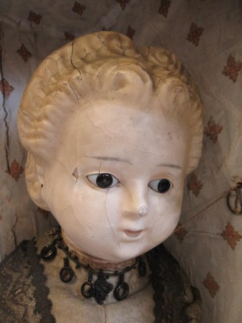 A wax head doll Image