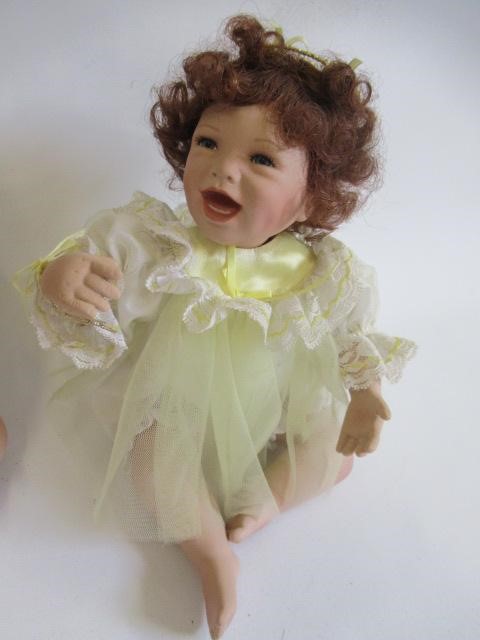 Five Ashton Drake baby dolls, all ceramic with jointed necks, shoulders and hips, one in a bath tub, Image