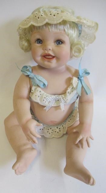 Five Ashton Drake baby dolls, all ceramic with jointed necks, shoulders and hips, one in a bath tub, Image