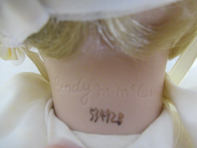 Six Ashton Drake all ceramic dolls, with jointed bodies and pink eyes, largest 17 1/2" long (Est. Image