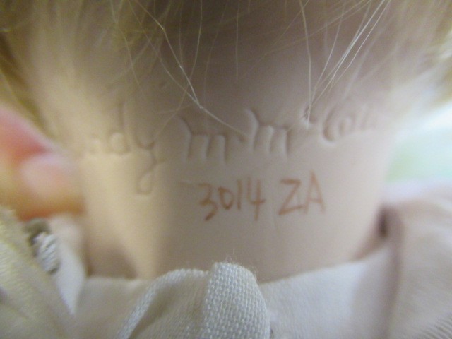 Six Ashton Drake all ceramic dolls, with jointed bodies and pink eyes, largest 17 1/2" long (Est. Image