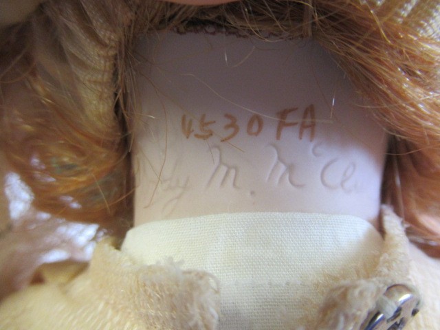 Six Ashton Drake all ceramic dolls, with jointed bodies and pink eyes, largest 17 1/2" long (Est. Image