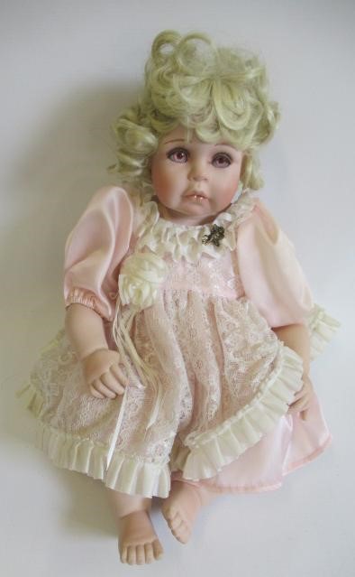 Six Ashton Drake all ceramic dolls, with jointed bodies and pink eyes, largest 17 1/2" long (Est. Image