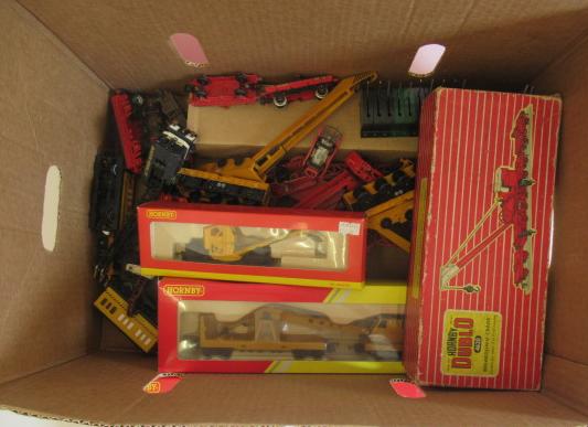 Unboxed railway breakdown cranes by Hornby and others, some items boxed, other damaged or parts Image
