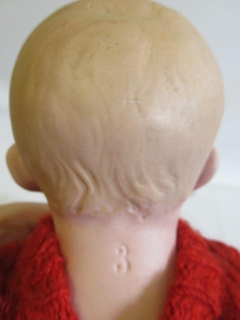 Three bisque head solemn boy dolls Image