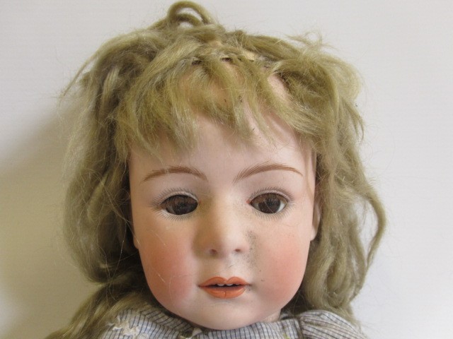 Two restored Heubach bisque socket head dolls Image