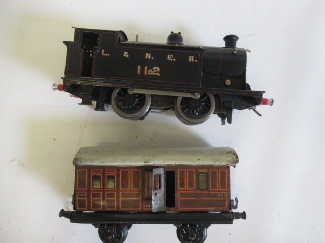 Bing 112 clockwork tank locomotive repainted in black with L.N.E.R. to tank sides, and a four wheel Image
