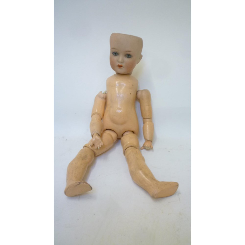 A Cuno and Otto Dressel bisque head doll with blue glass sleeping eyes Image