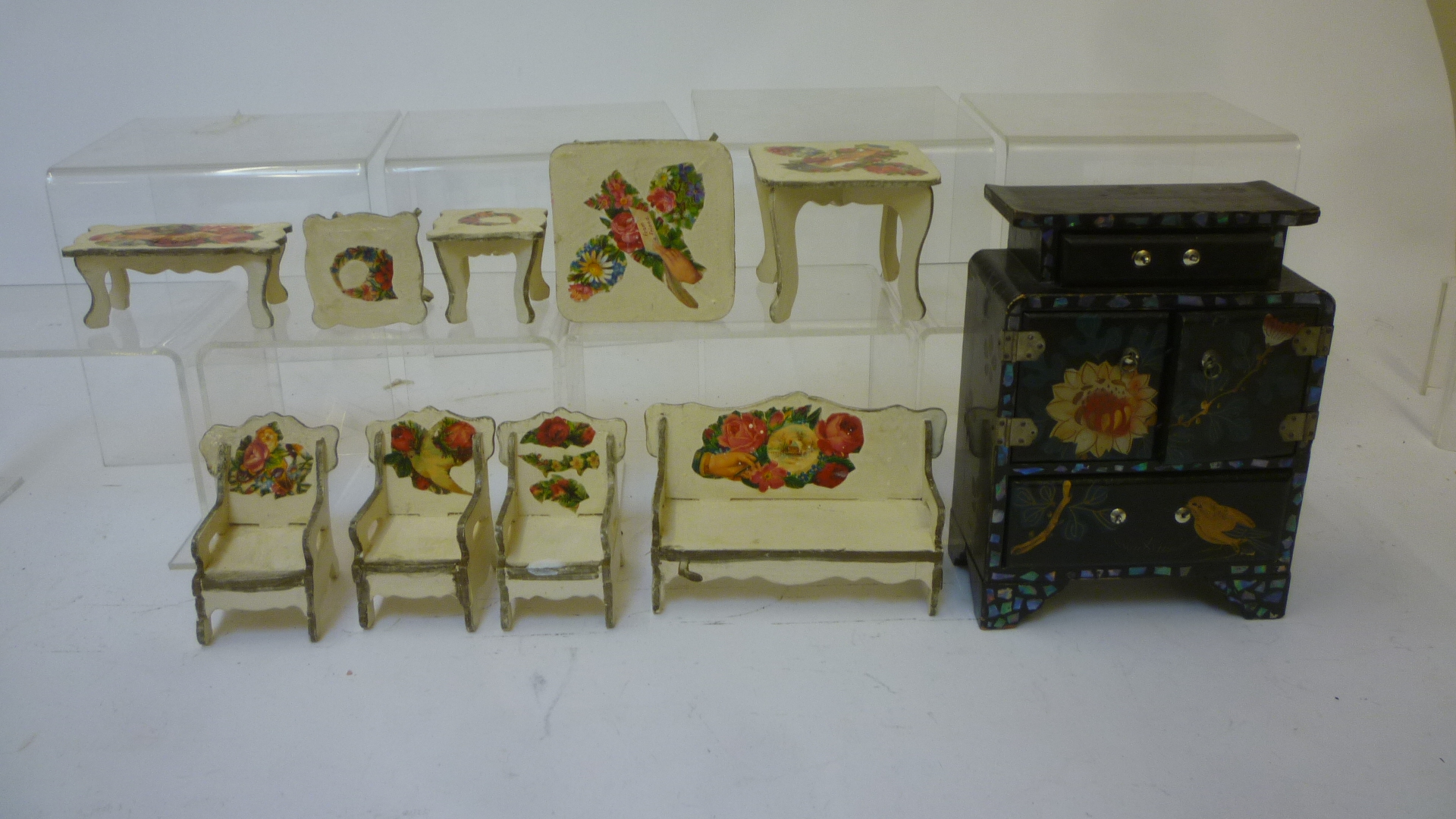 A suite of painted wood dolls house furniture with printed scrap decoration Image