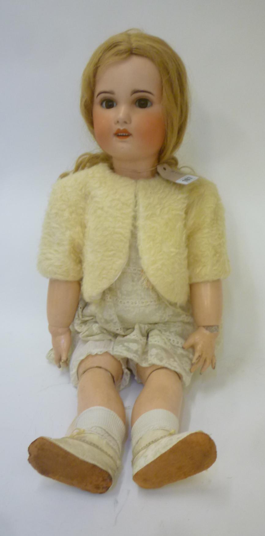 A Jumeau S.F.B.J. bisque head doll with brown glass sleeping eyes Image
