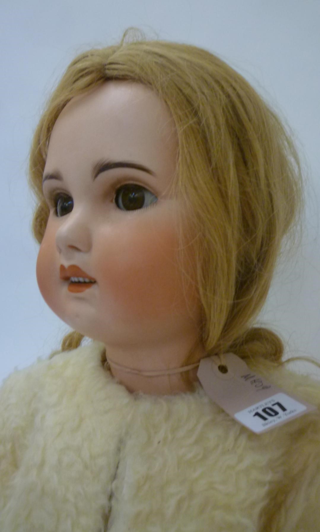 A Jumeau S.F.B.J. bisque head doll with brown glass sleeping eyes Image