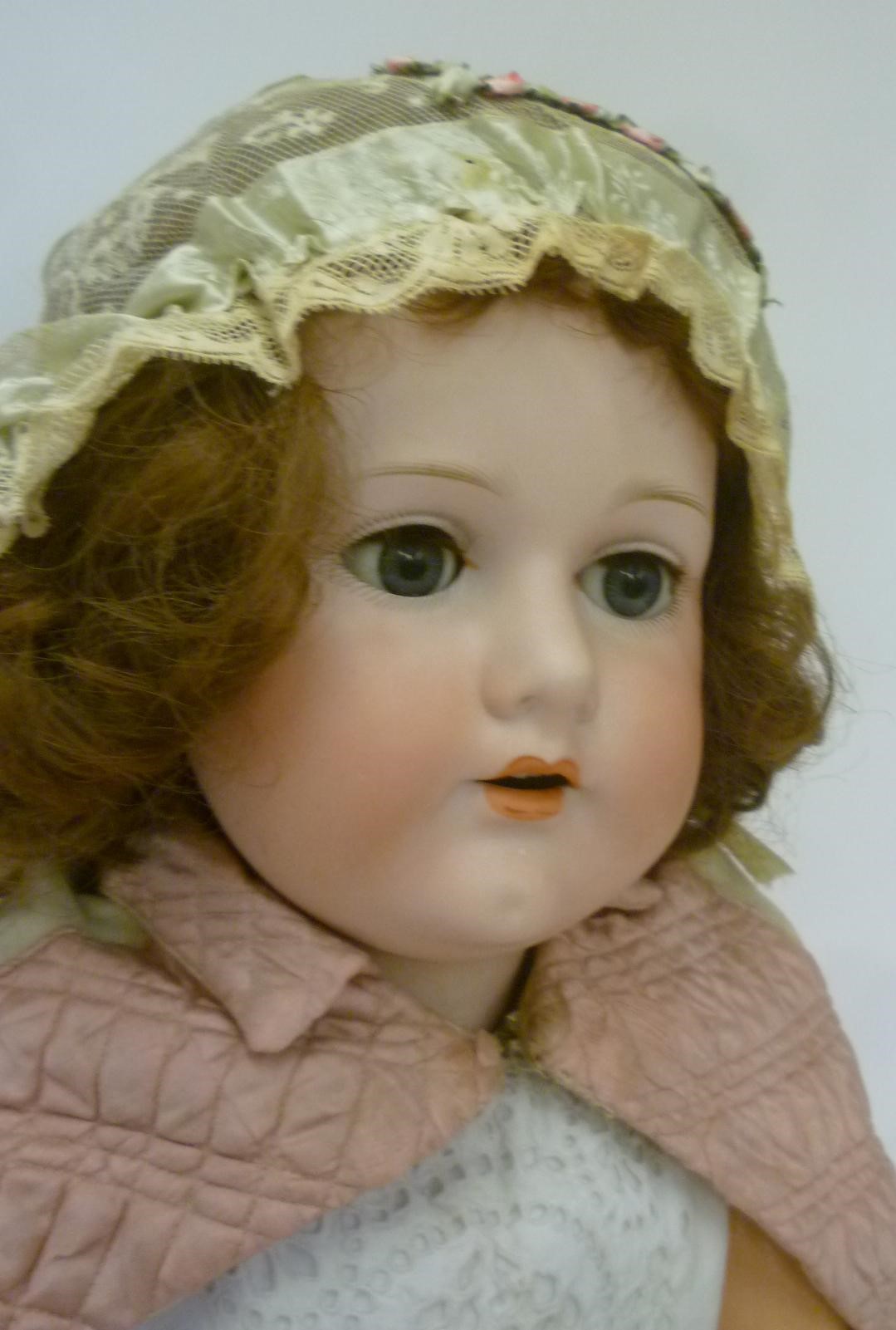A C.M. Bergmann bisque head doll with blue glass sleeping eyes Image