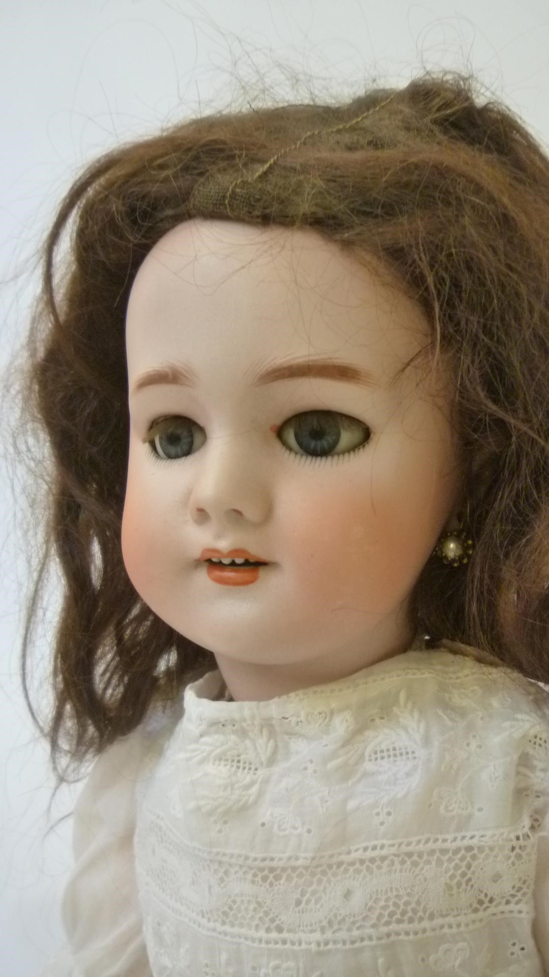 A French Dep bisque head doll with blue glass sleeping eyes Image