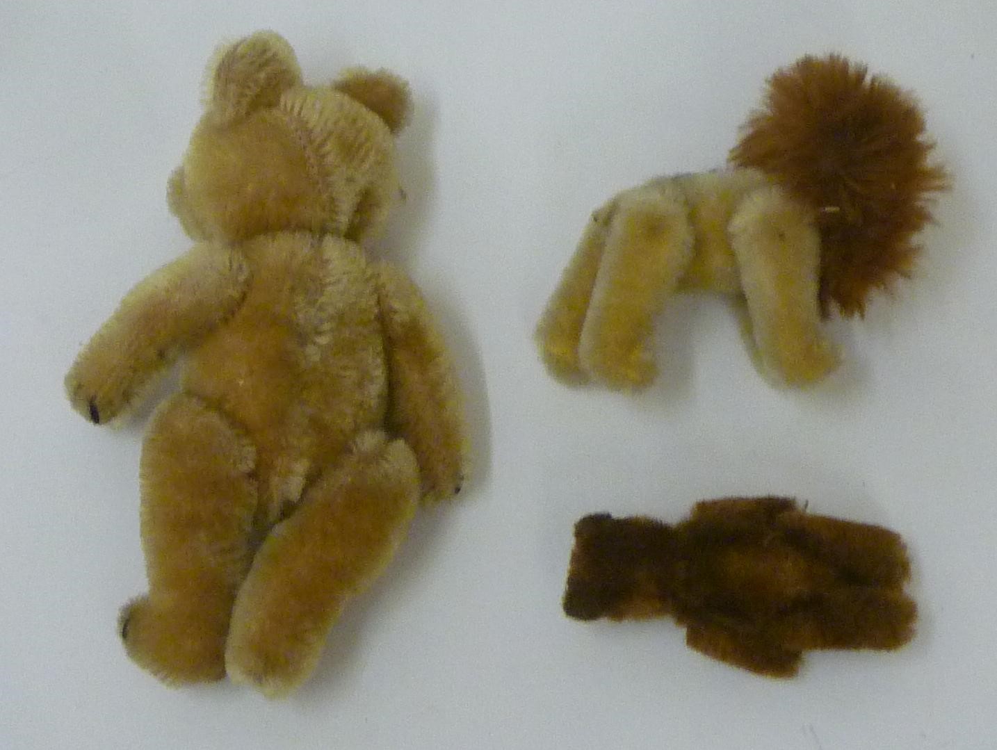 A Schuco miniature lion with button eyes Image