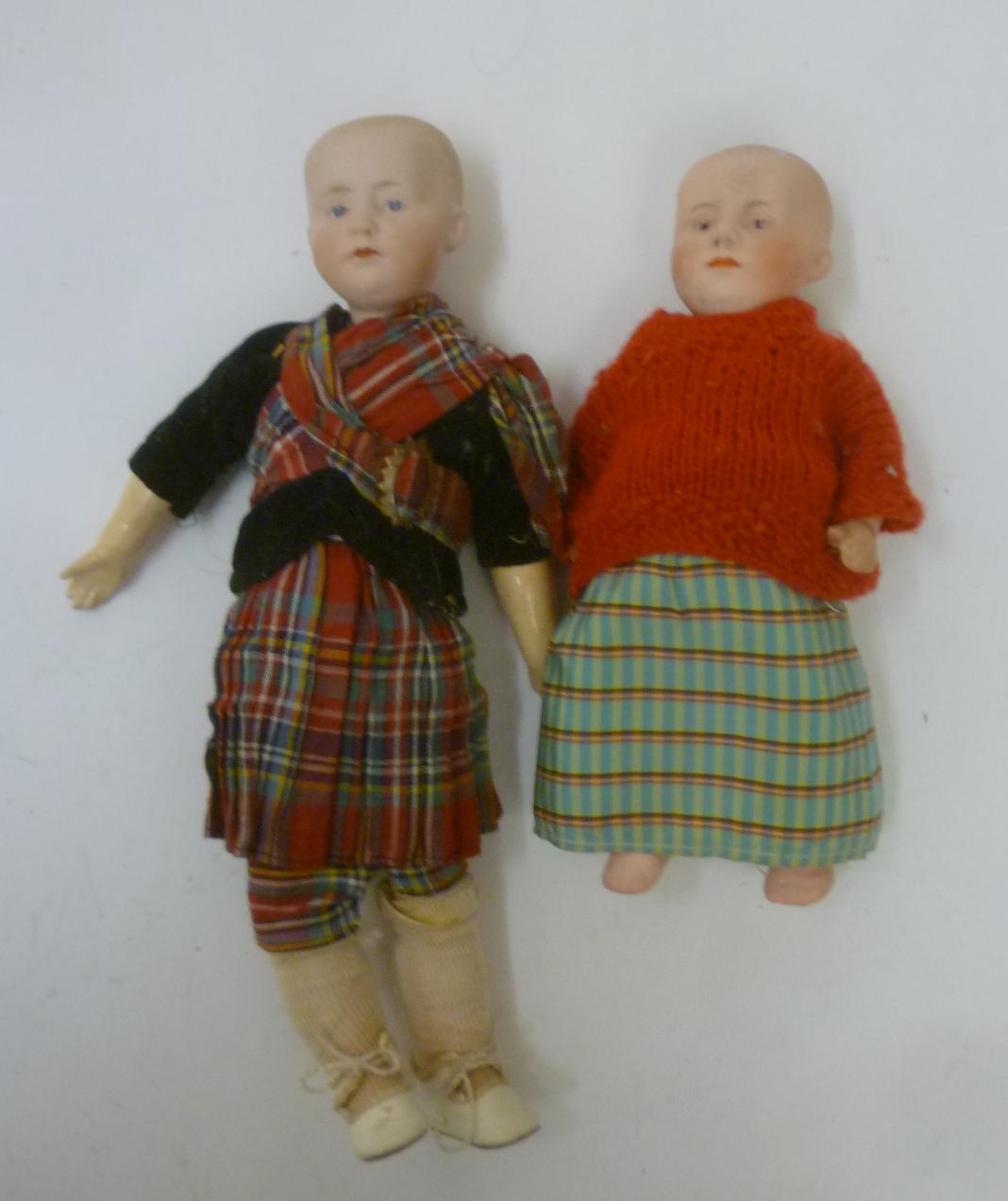 A Gebruder Heubach bisque head "solemn boy" doll with painted face Image