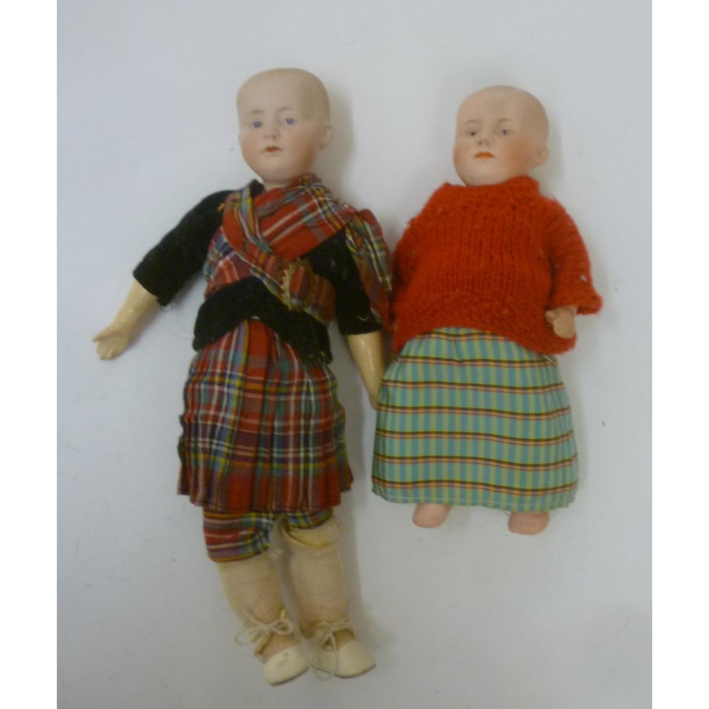 A Gebruder Heubach bisque head "solemn boy" doll with painted face Image