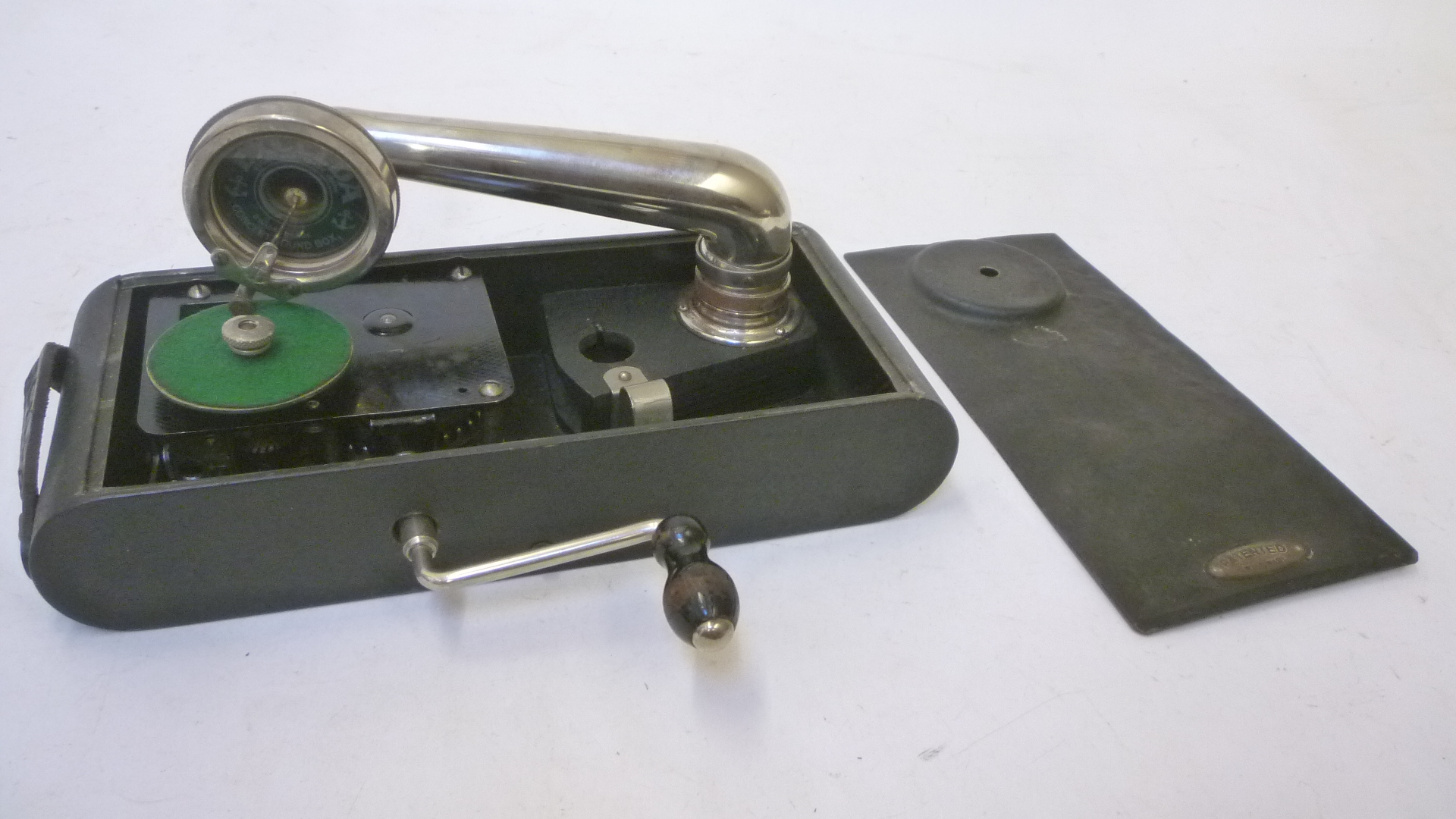 An Excelda "camera" gramophone with black japanned metal case and wind up motor Image