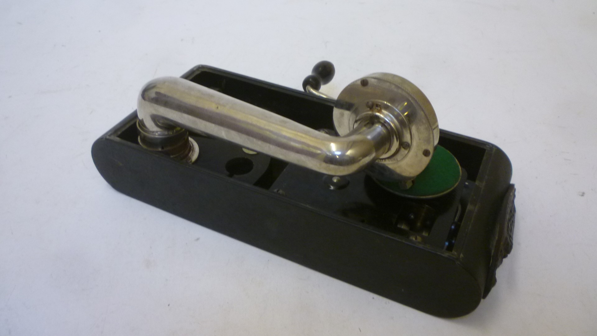 An Excelda "camera" gramophone with black japanned metal case and wind up motor Image