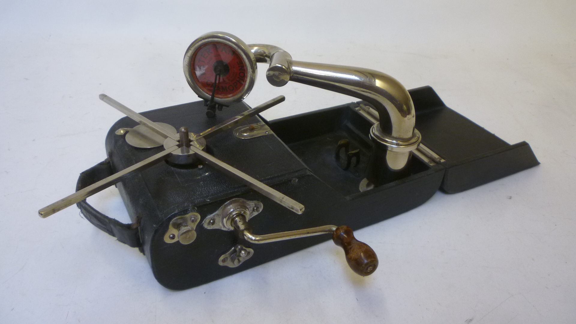 A Peter Pan "camera" gramophone with folding black leather cloth covered wood case Image