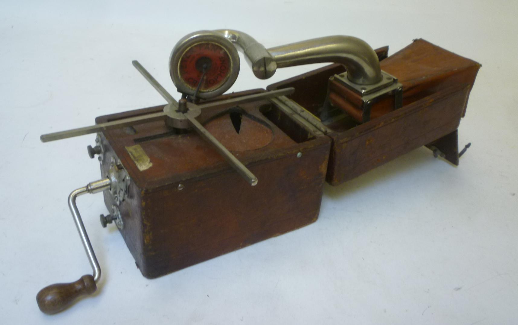 A Peter Pan "Camera" gramophone with folding brown leather covered wood case Image