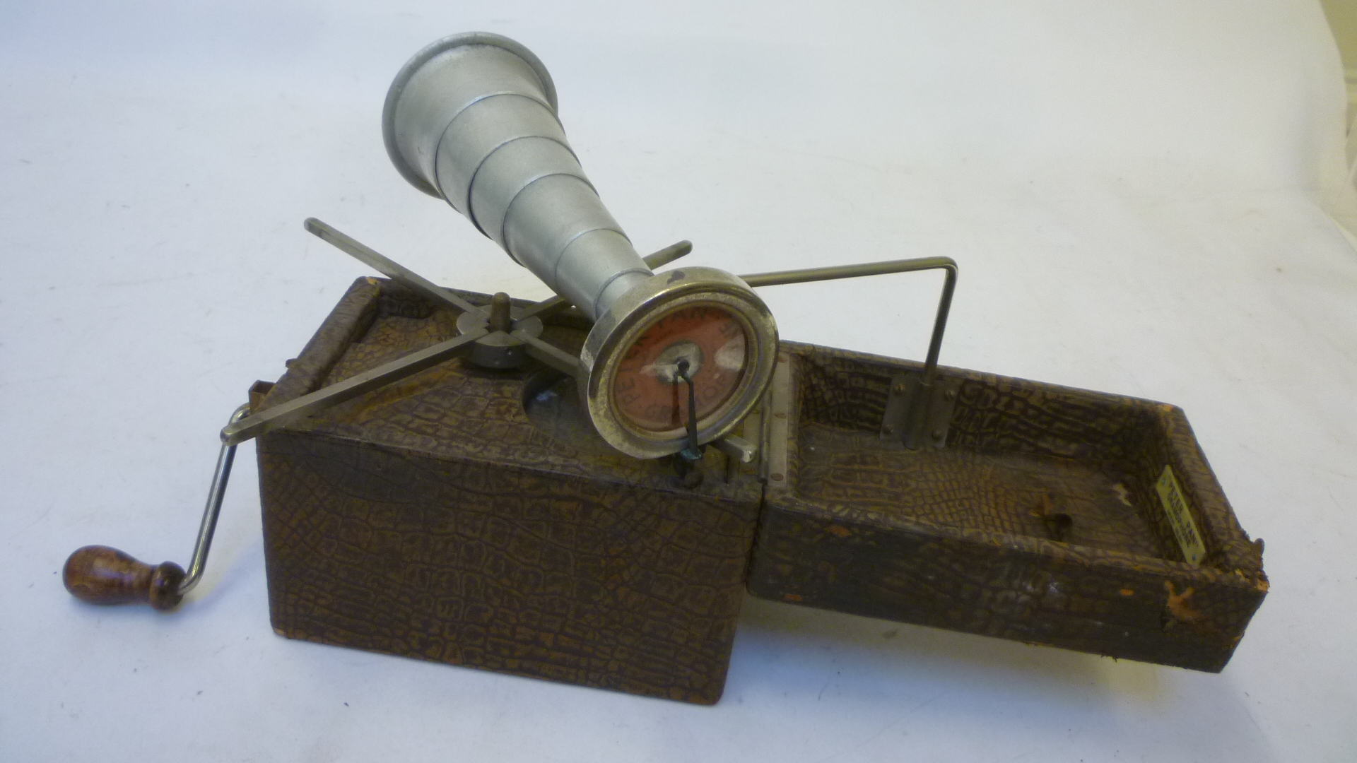 A Peter Pan "Camera" gramophone with fold-out brown leather cloth covered wood case Image