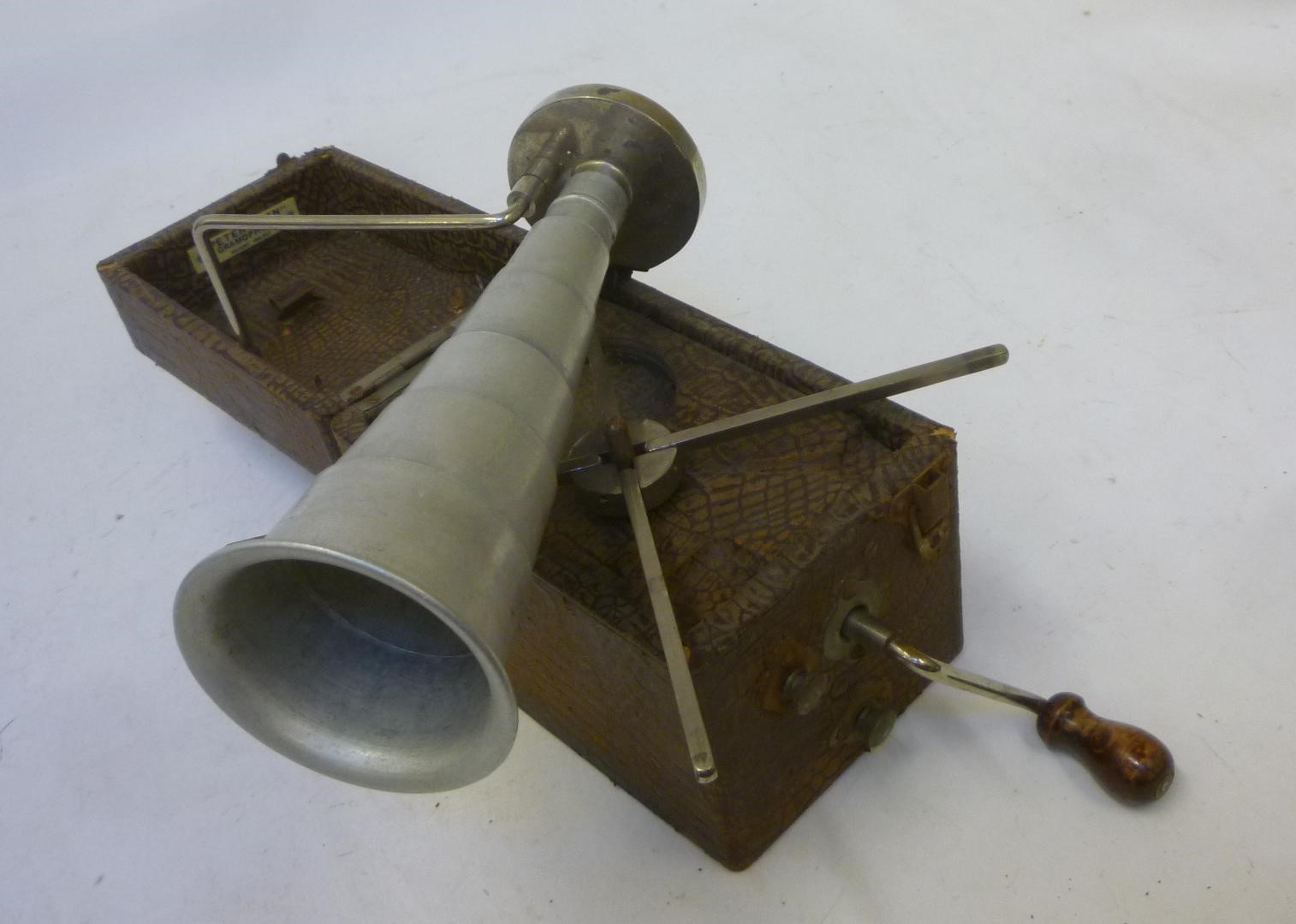 A Peter Pan "Camera" gramophone with fold-out brown leather cloth covered wood case Image