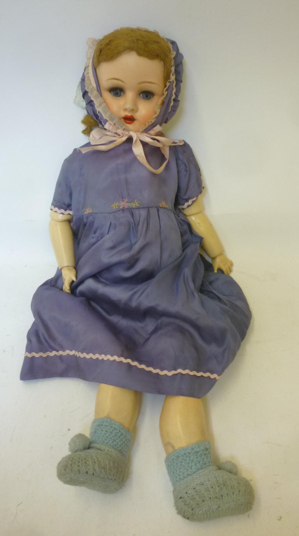 A Belgian sprayed bisque head doll Image