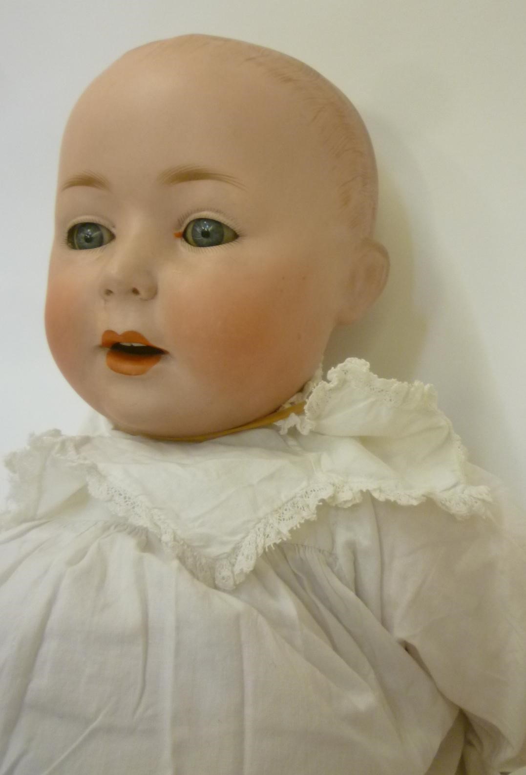 A German bisque head boy character doll Image