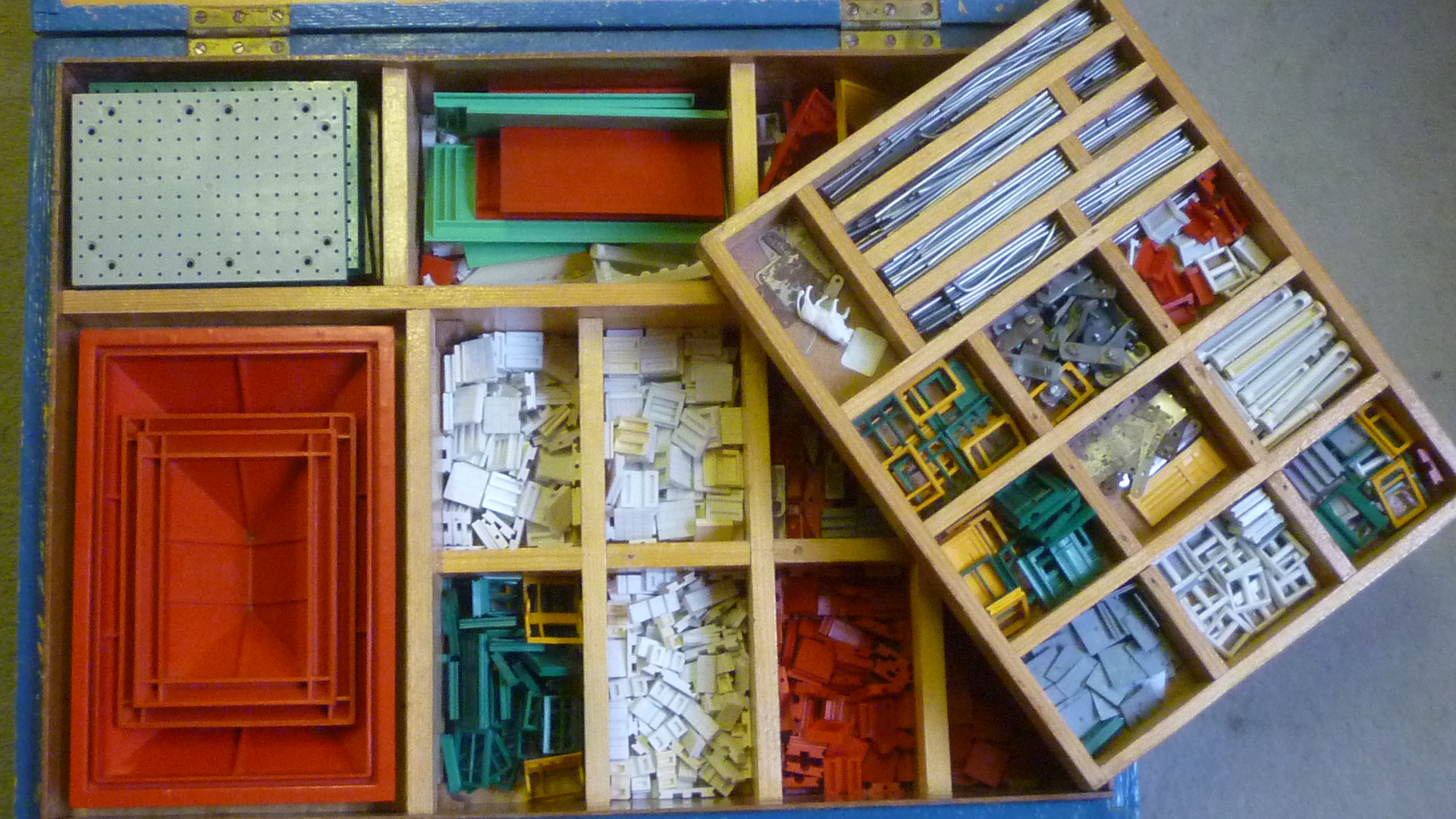 A large quantity of Bayko Building Set parts mainly in red Image