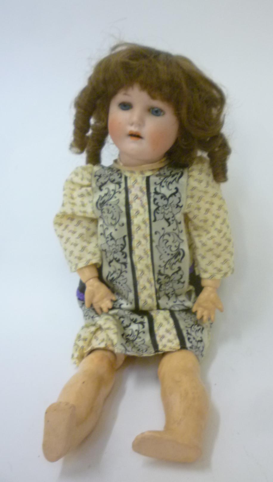 A Max Handwercke "Bebe Elite" bisque head doll with blue glass sleeping eyes Image