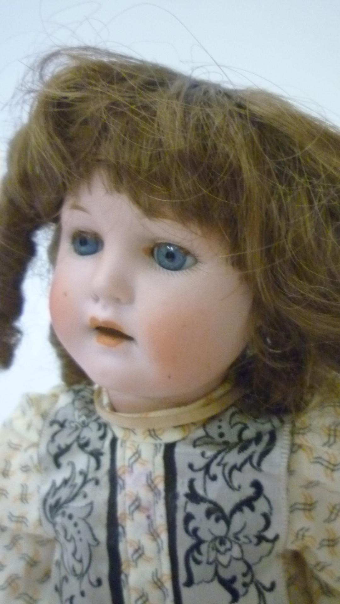 A Max Handwercke "Bebe Elite" bisque head doll with blue glass sleeping eyes Image