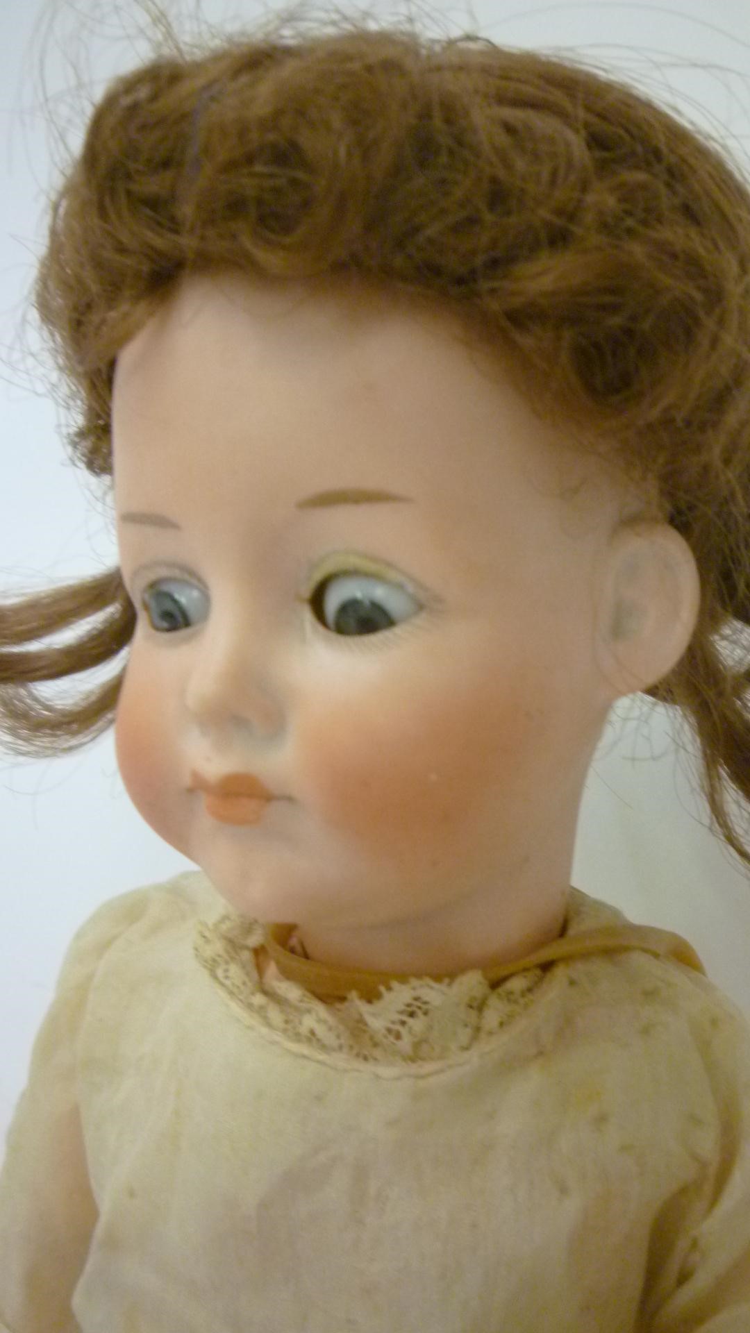 A German bisque head doll Image