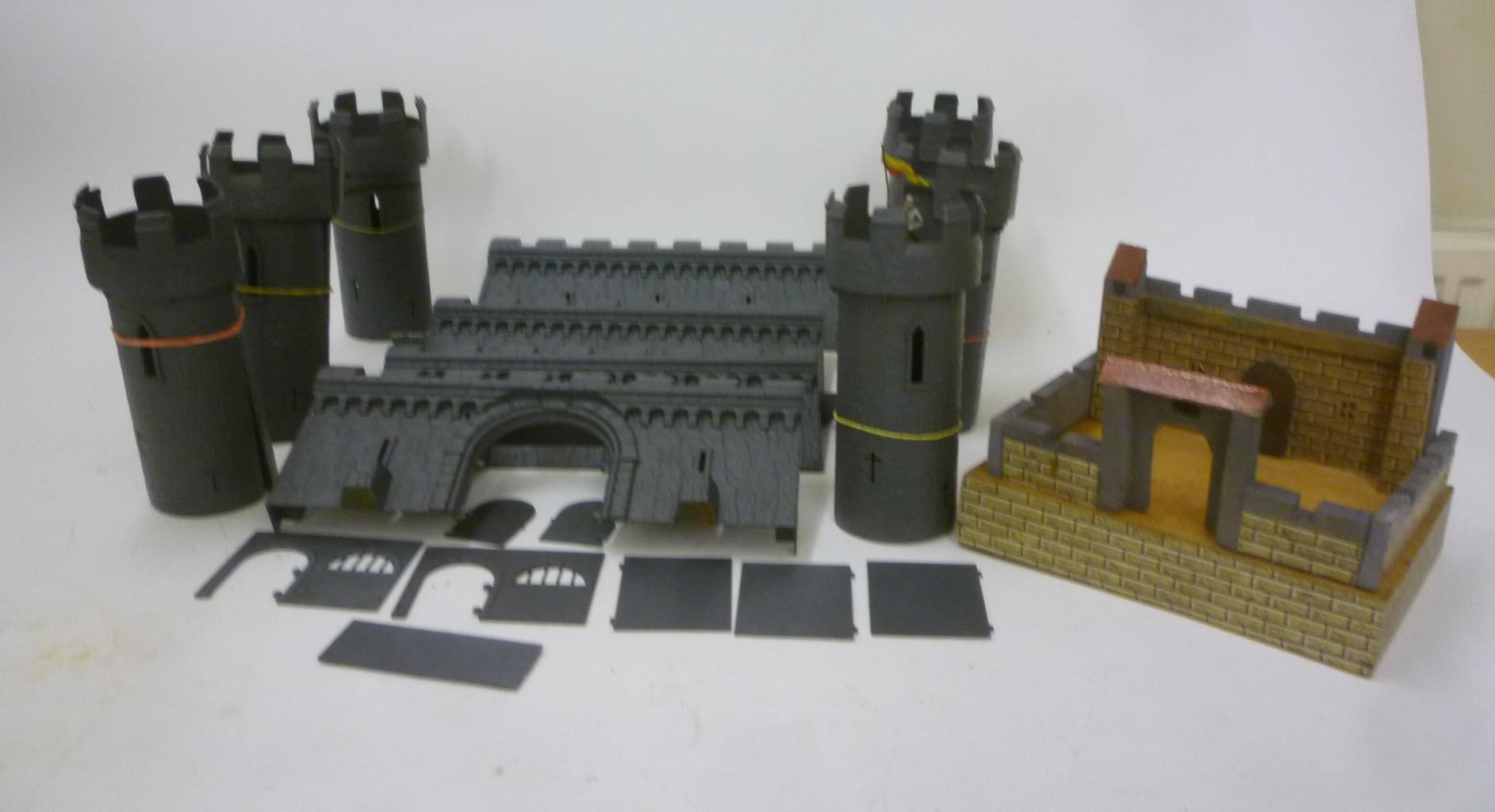 A painted wood castle dismantling into sections on base Image