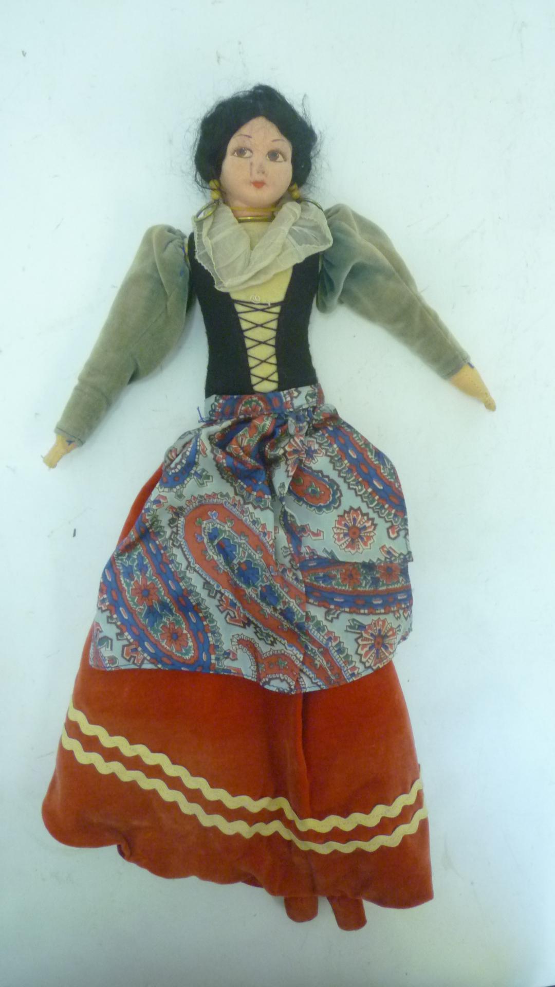 A Norah Wellings soft doll pyjama case with moulded painted face Image