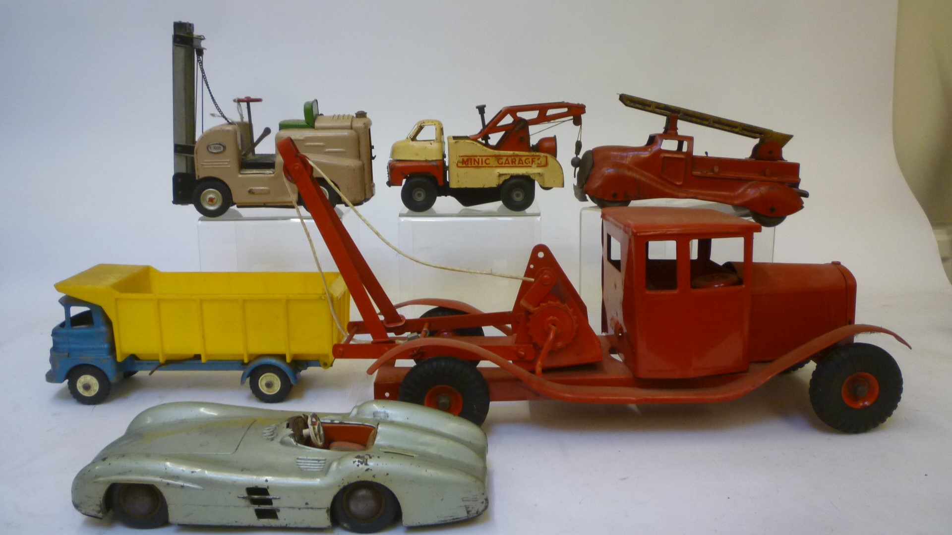 Eight tinplate vehicles comprising Japanese Ford Mustang stunt car Image